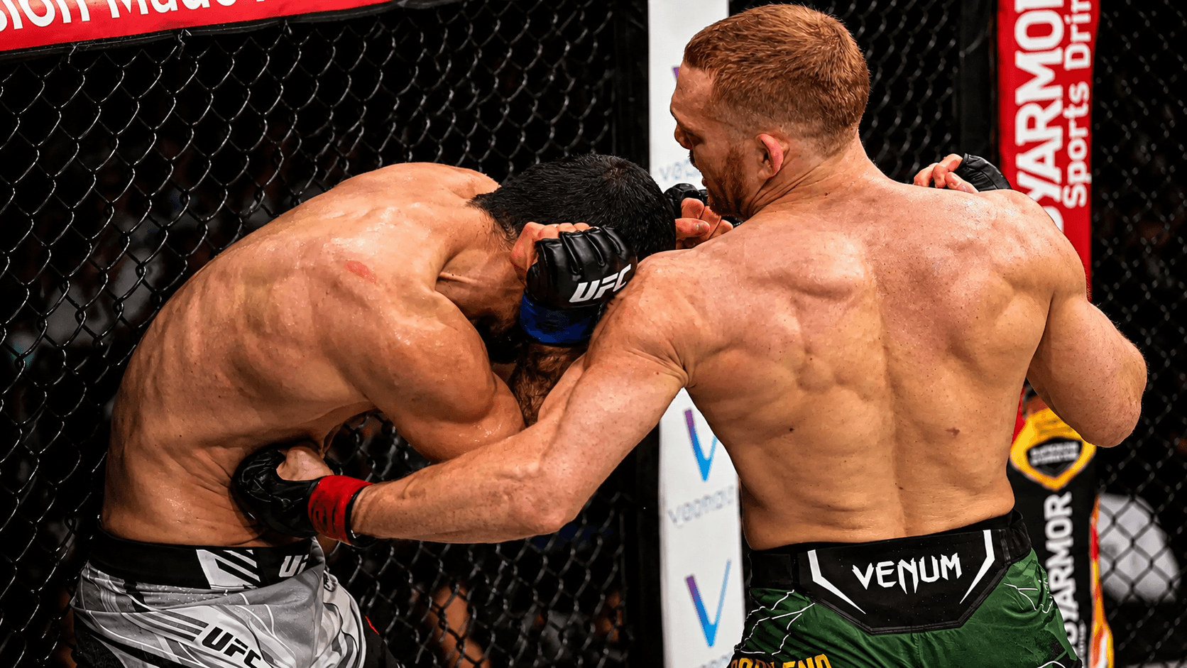 A fighter landing a punch to the body.
