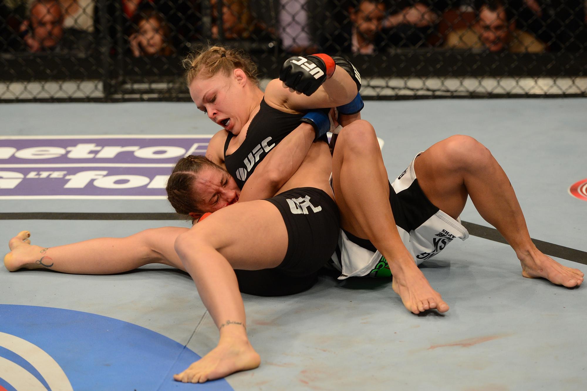 Ronda Rousey working from top position against Liz Carmouche at UFC 157, February 2013.